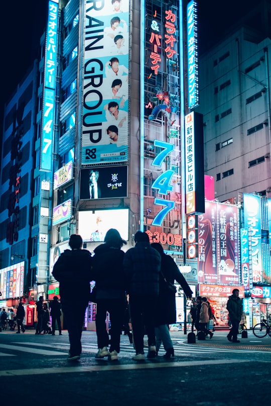 people walking on street during night time in Shibuya Japan