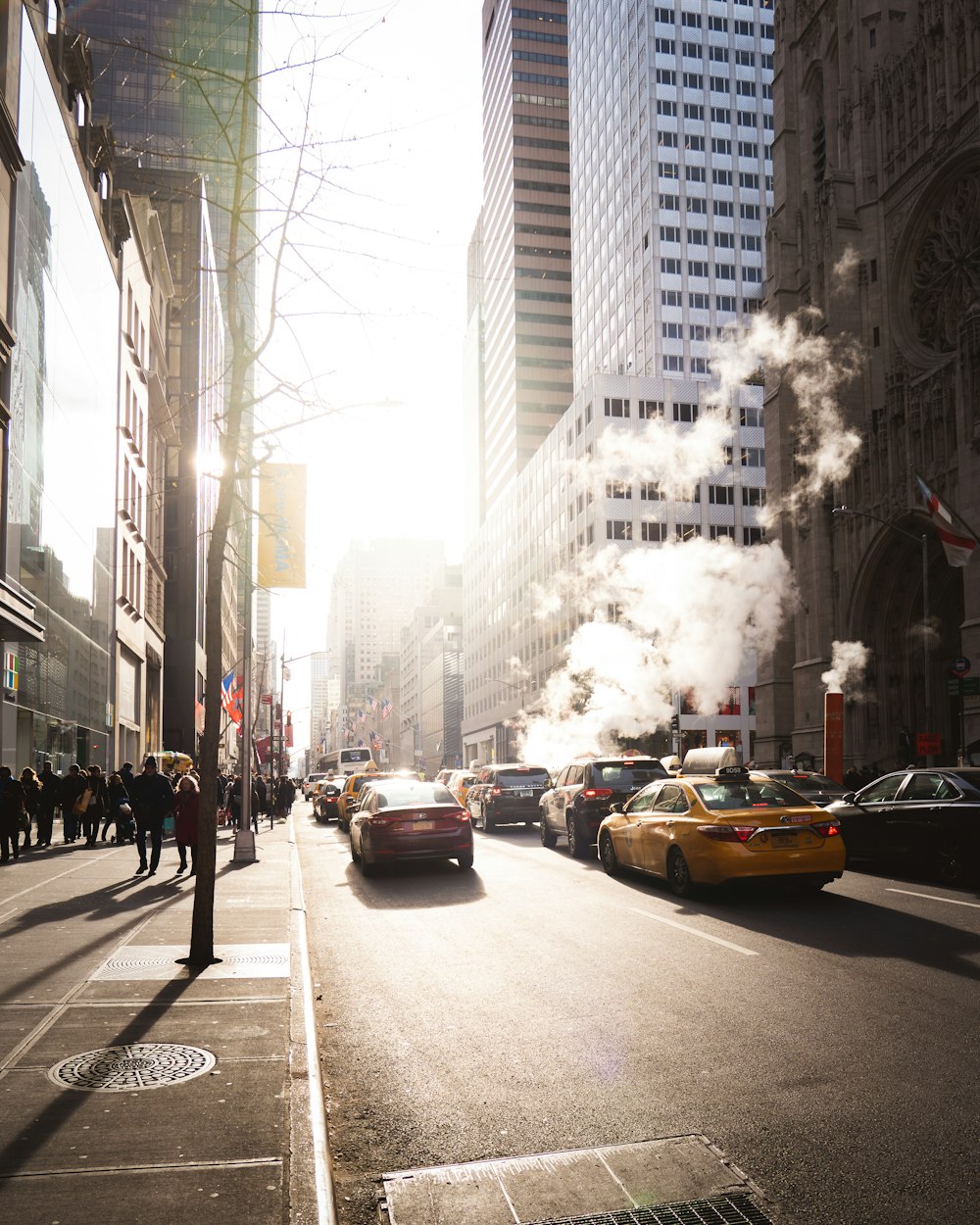 people walking on sidewalk near buildings during daytime