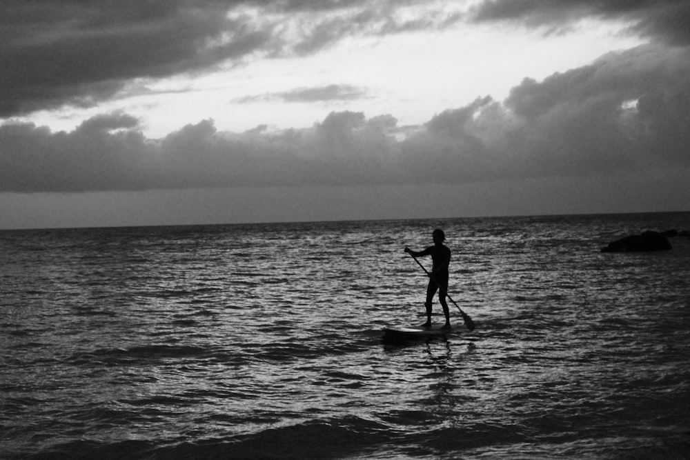 silhouette of man in the middle of the sea