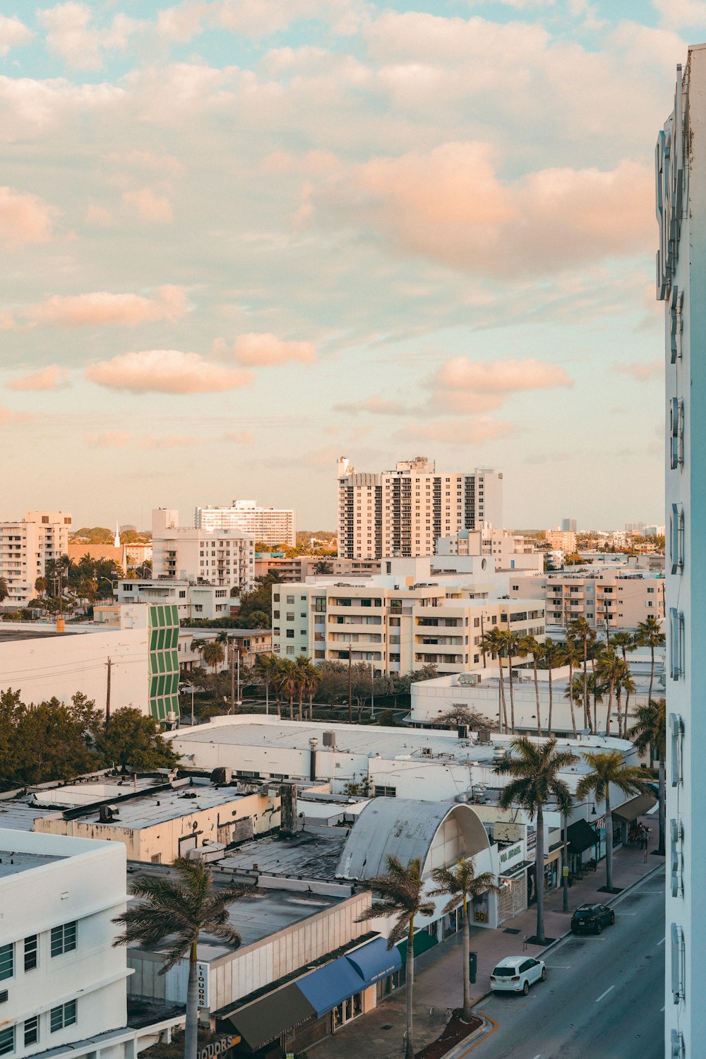 city buildings under white clouds during daytime