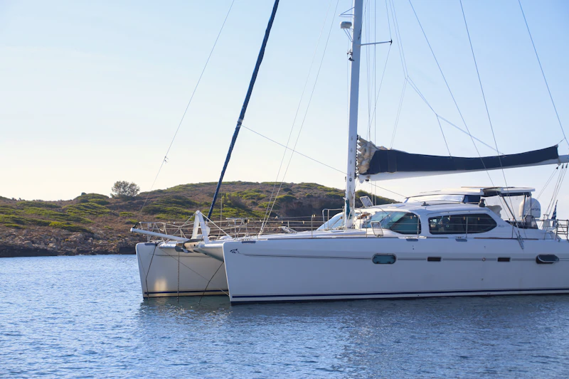 Cruising sailing catamaran at anchor
