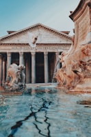 white concrete building with water fountain