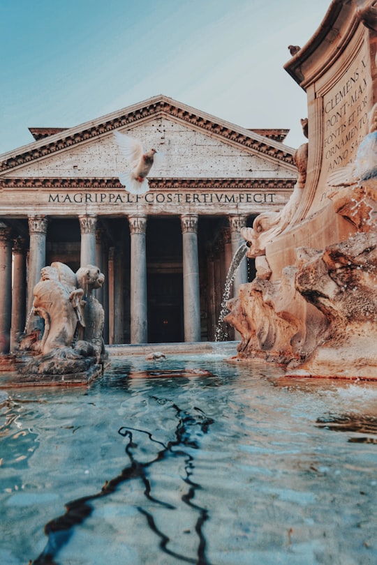 white concrete building with water fountain in Pantheon Italy