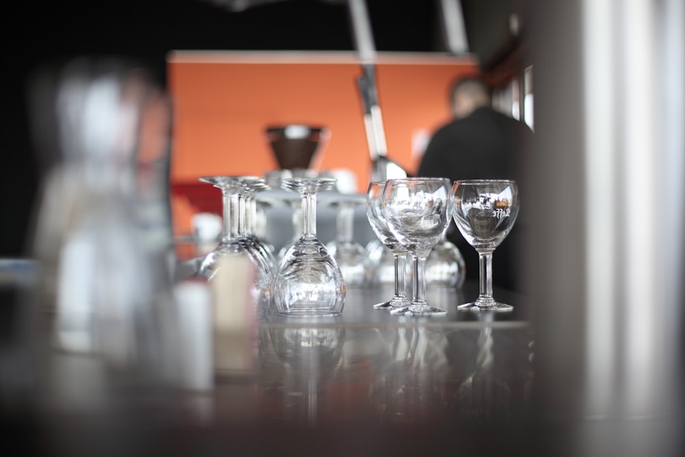 clear glass pitcher and clear glass pitcher on table