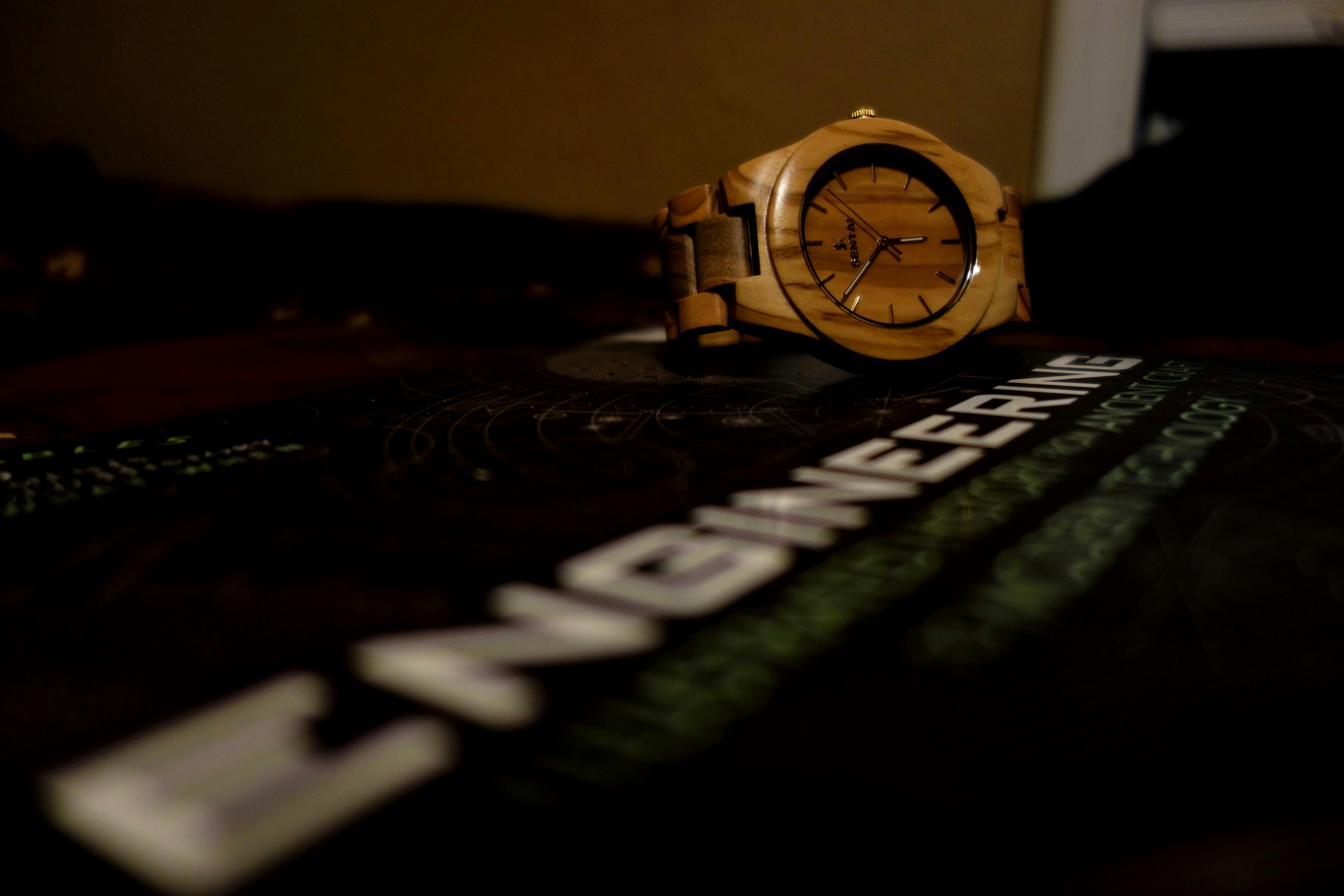 gold and silver round analog watch