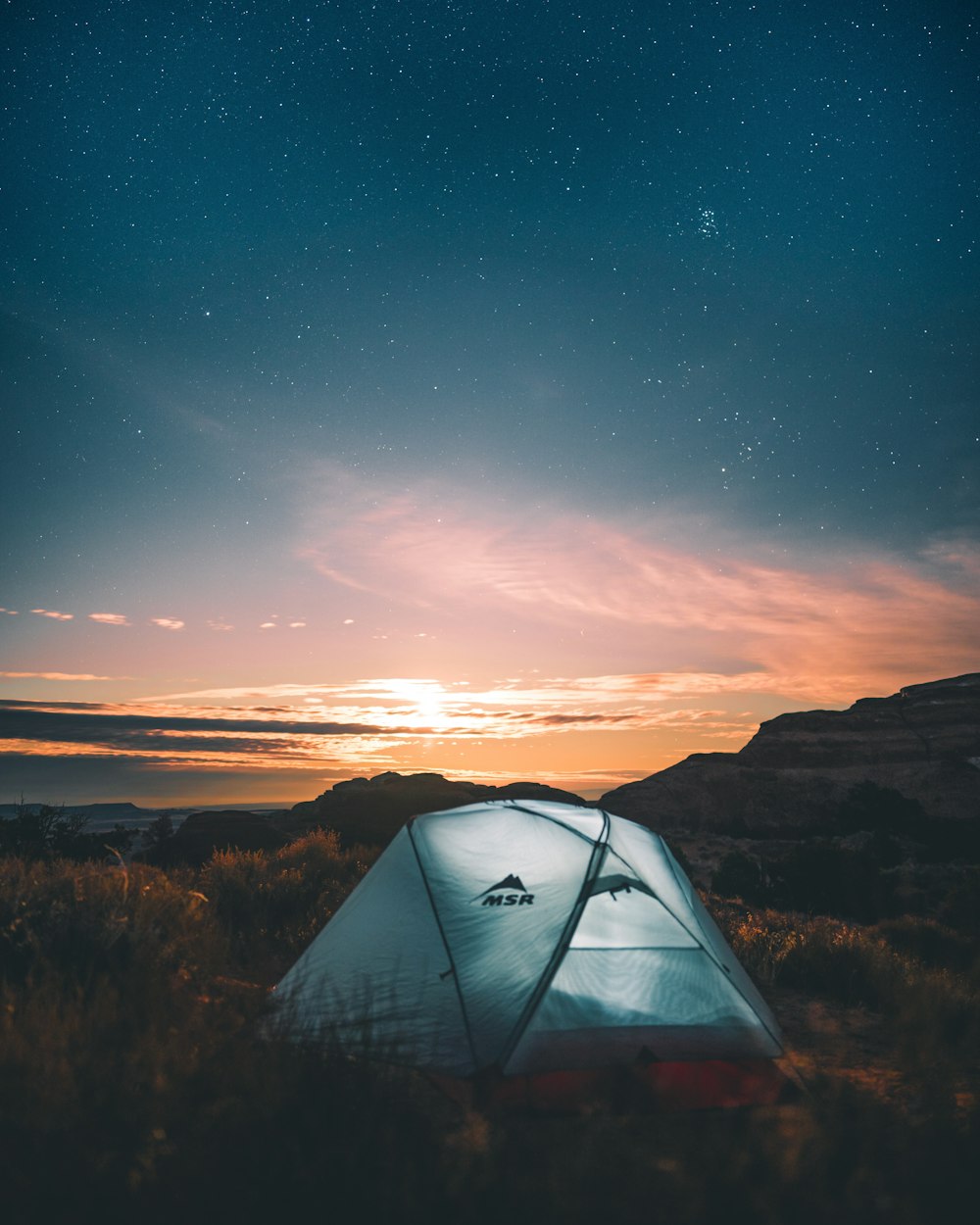 white tent under blue sky during night time