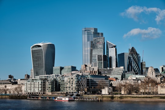 city skyline under blue sky during daytime in Potters Fields Park United Kingdom