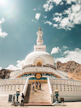 white and gold temple under blue sky