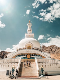 white and gold temple under blue sky