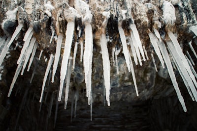 white snow on brown wooden surface icicle google meet background