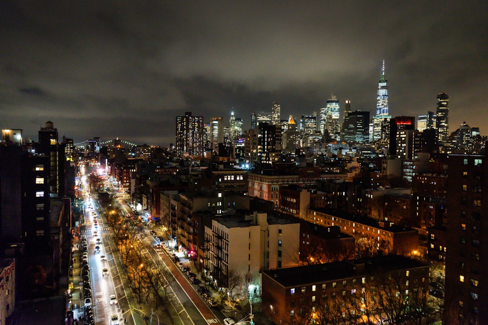 city with high rise buildings during night time