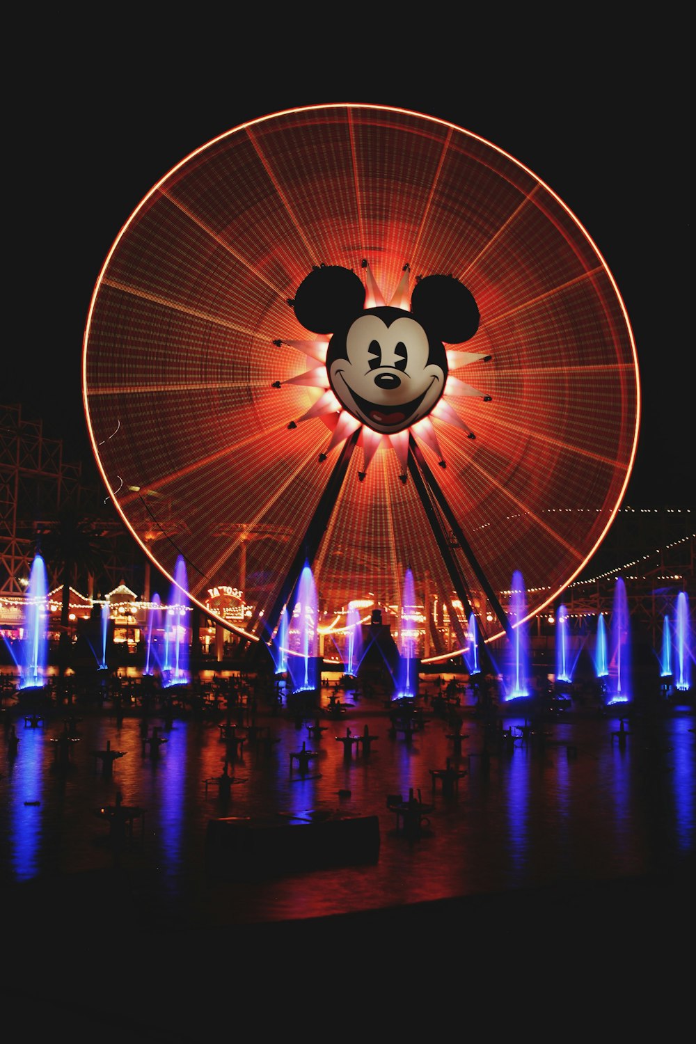 blue and white lighted ferris wheel during night time