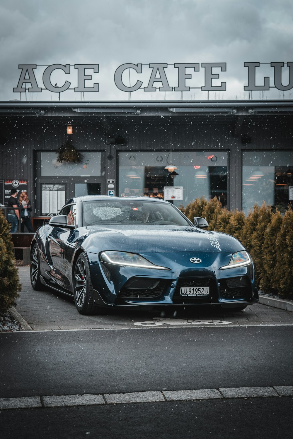 black porsche 911 parked on street during daytime