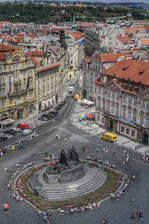 A panoramic view of a bustling Michoacán town square with people engaging in daily activities
