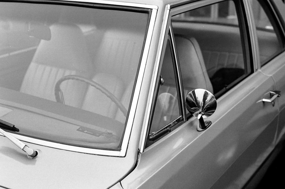 grayscale photo of car door