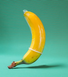 yellow banana fruit on green textile
