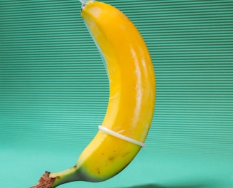 yellow banana fruit on green textile