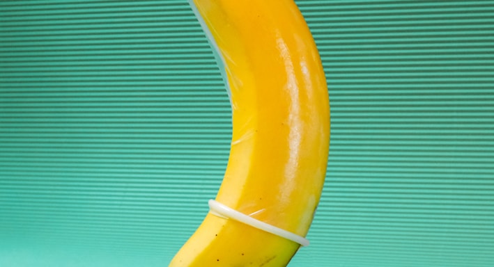 yellow banana fruit on green textile