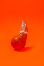 red apple fruit on red table