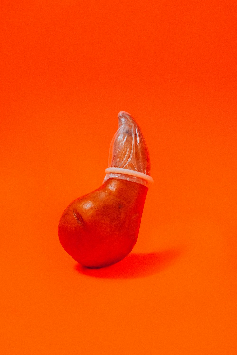 red apple fruit on red table