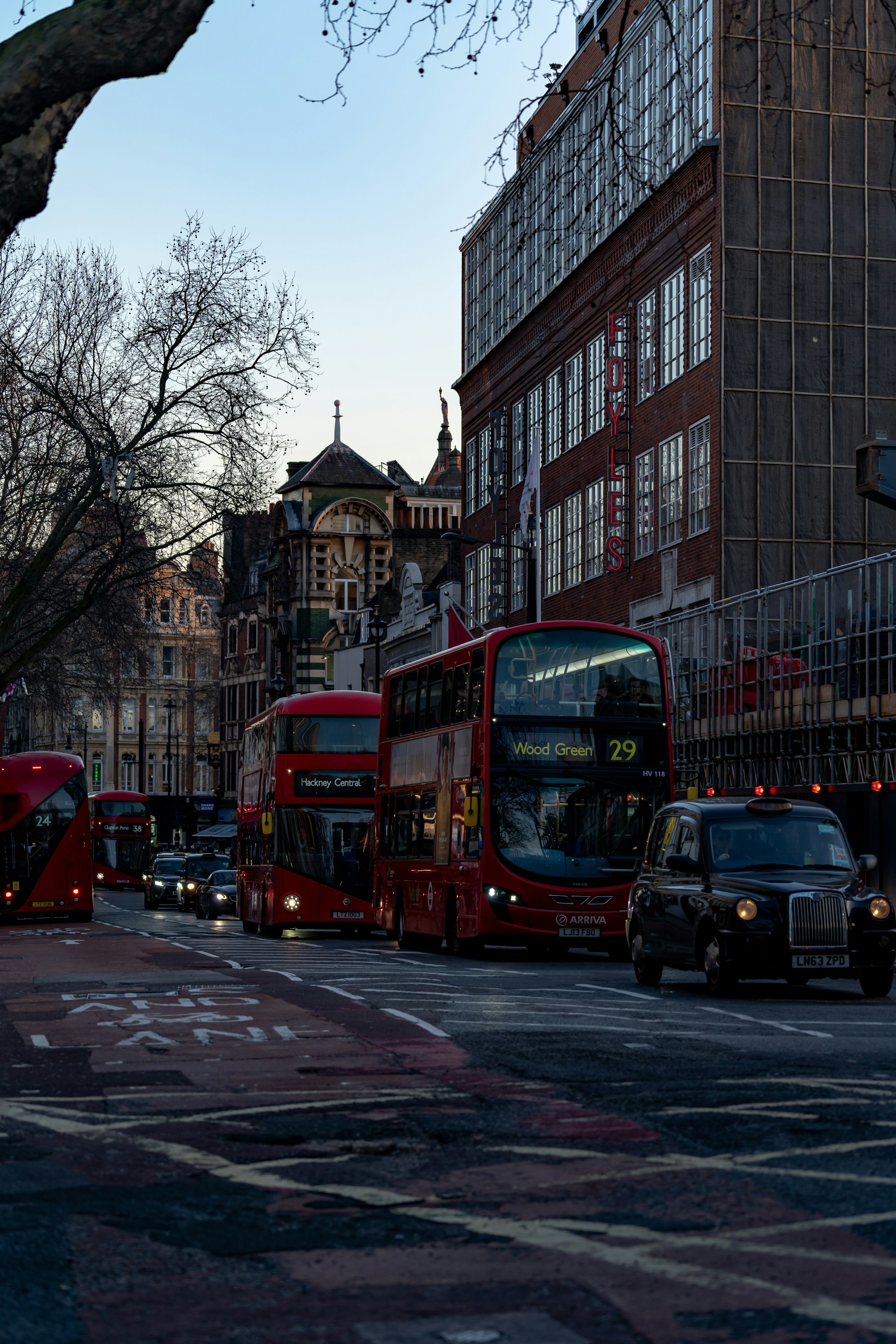 red double decker bus on road during daytime