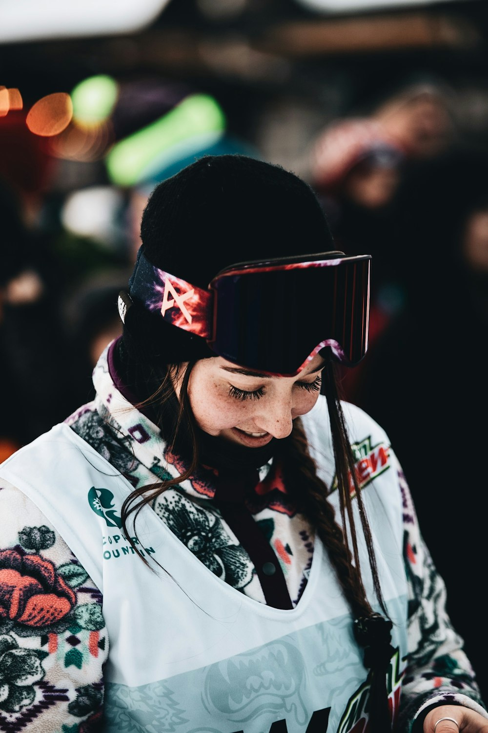 woman in white and red floral shirt wearing black sunglasses