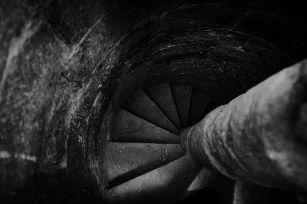 grayscale photo of spiral staircase