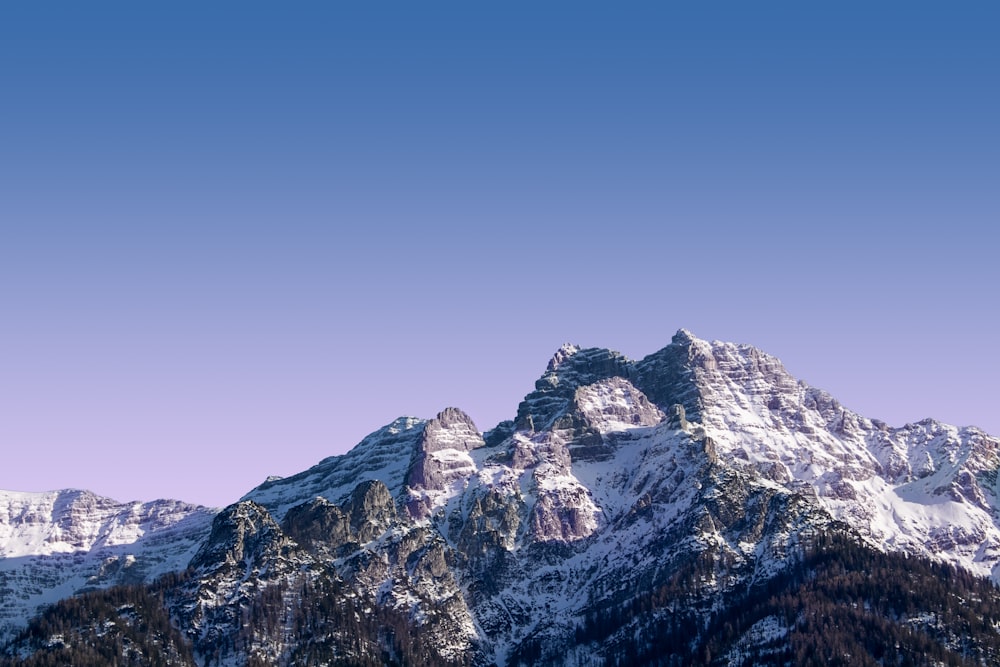 brown and white rocky mountain under blue sky during daytime