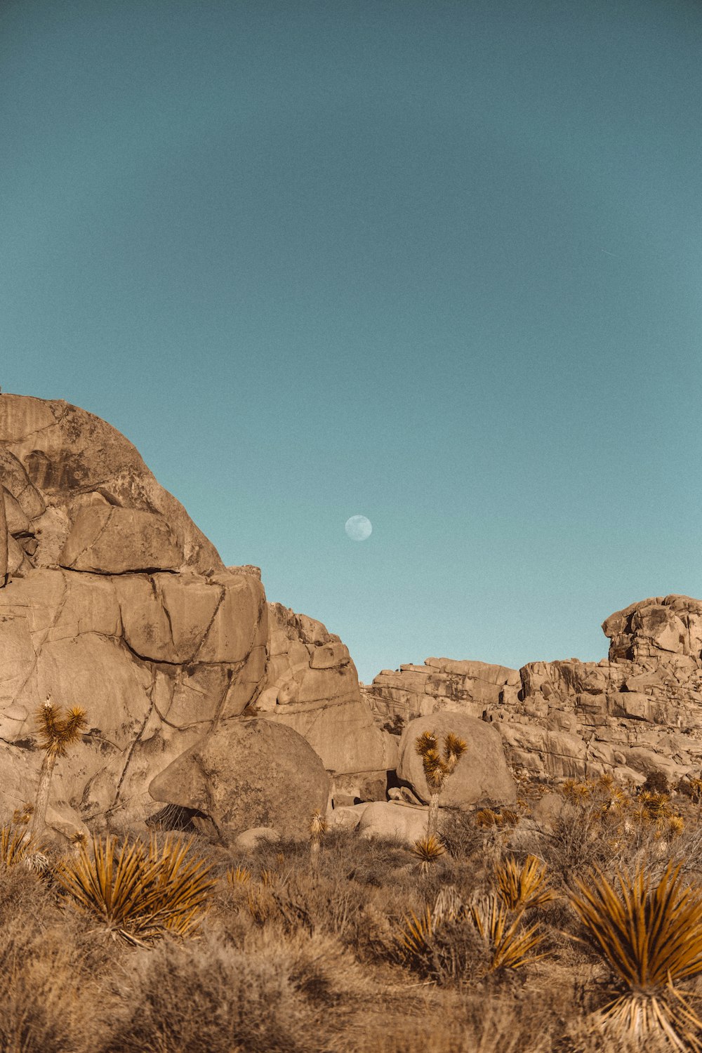 brown rock formation under blue sky during daytime