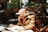 man in brown coat writing on white paper