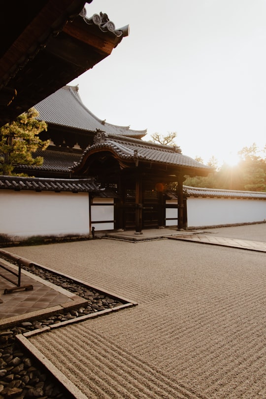 brown and white wooden house near green trees during daytime in Shokokuji Temple Japan