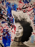 A mixed media portrait features a woman's face in black and white on a torn paper effect, integrated with a vibrant abstract background of blue, red, and black splashes reminiscent of abstract expressionism.