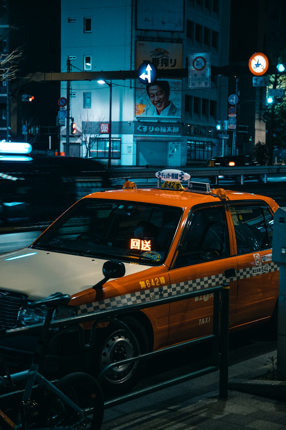 yellow taxi cab on street during night time