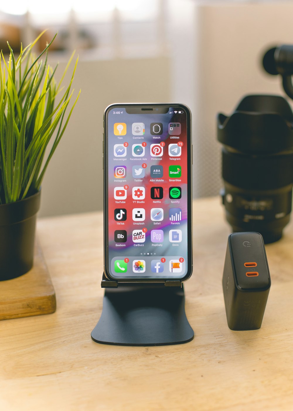 black iphone 5 on brown wooden table