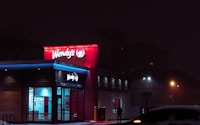 red and white concrete building during nighttime