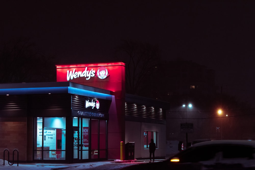 red and white concrete building during nighttime