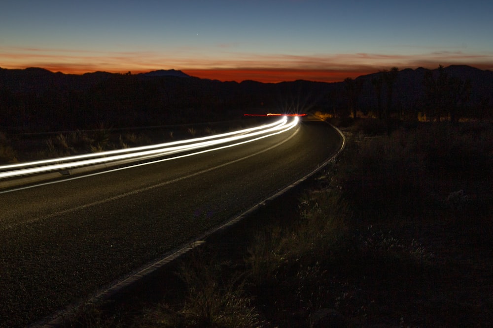 time lapse photography of road during night time