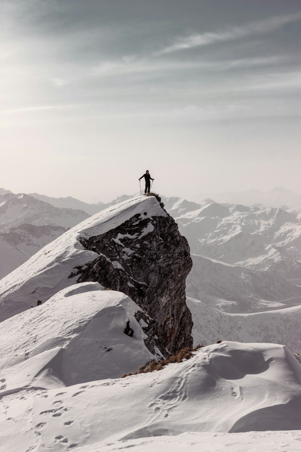 person standing on top of mountain during daytime