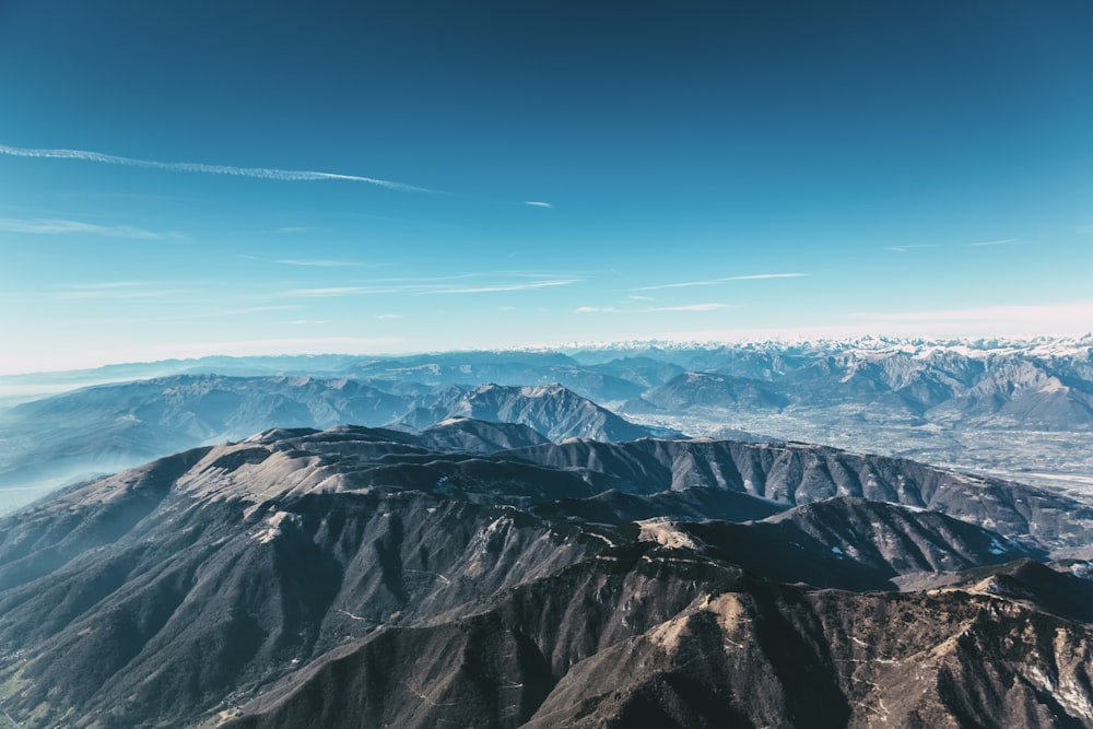 black and white mountains under blue sky during daytime