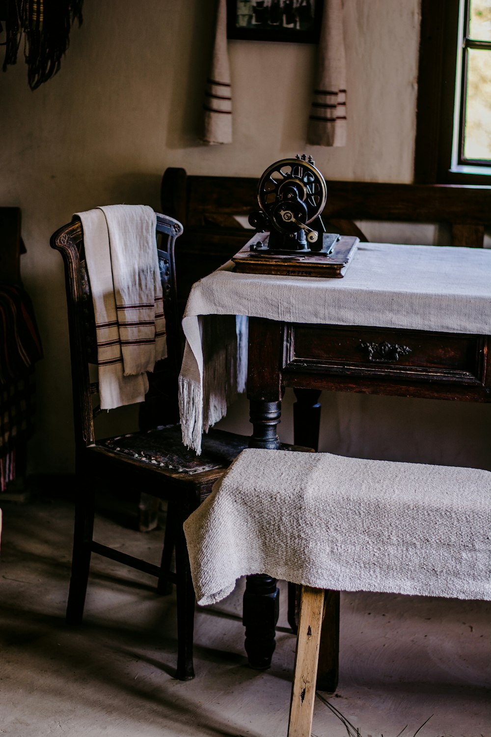 black and white sewing machine on brown wooden table