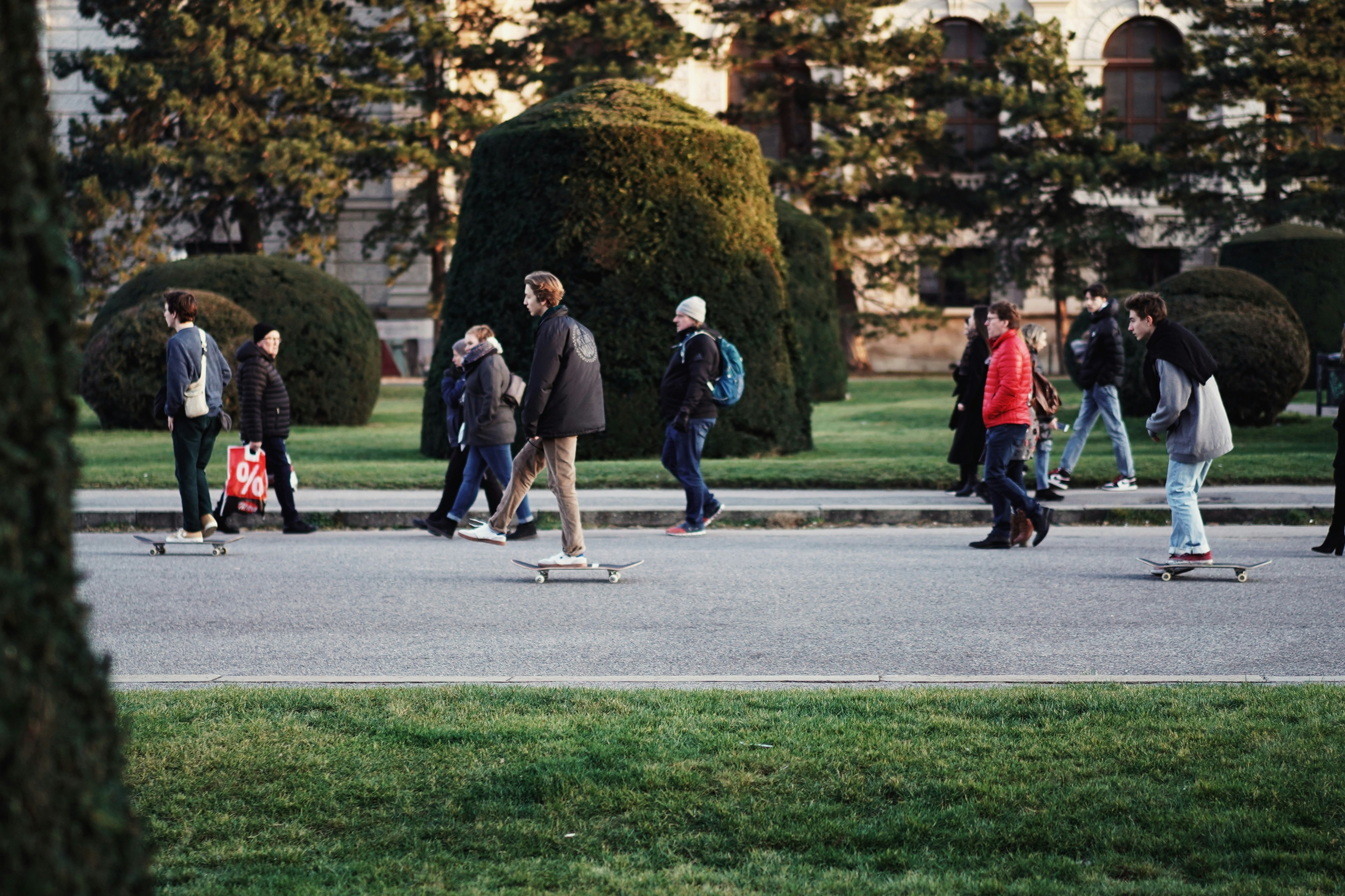 people walking on gray concrete pathway during daytime