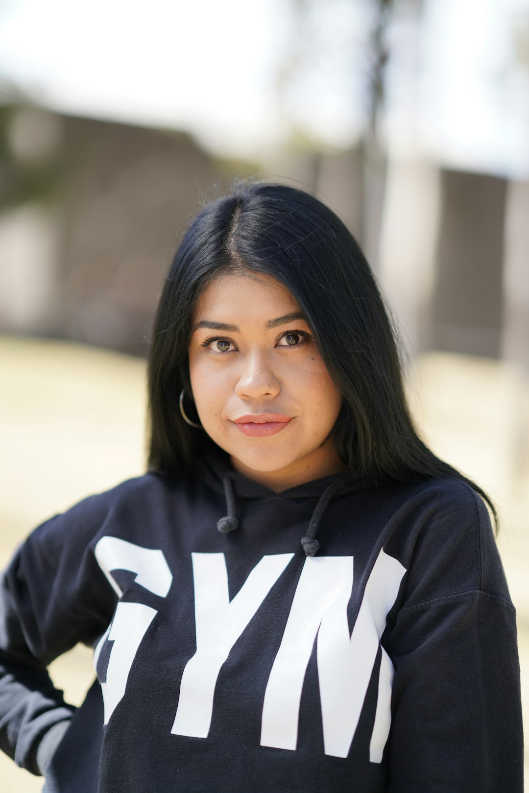 woman in black and white adidas hoodie