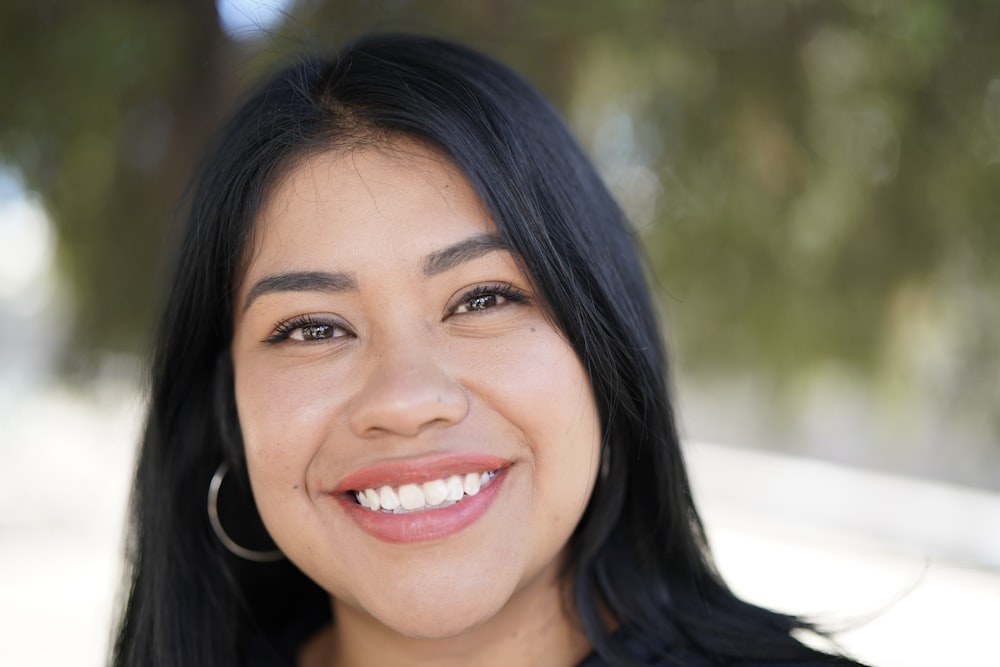 smiling woman in black shirt