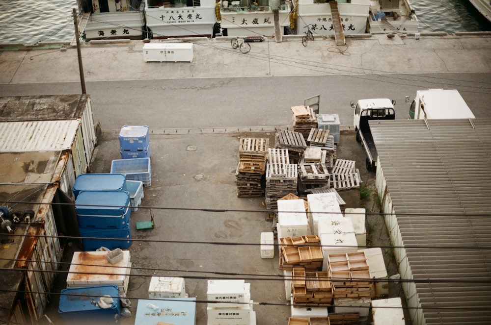 brown cardboard boxes on blue plastic crate