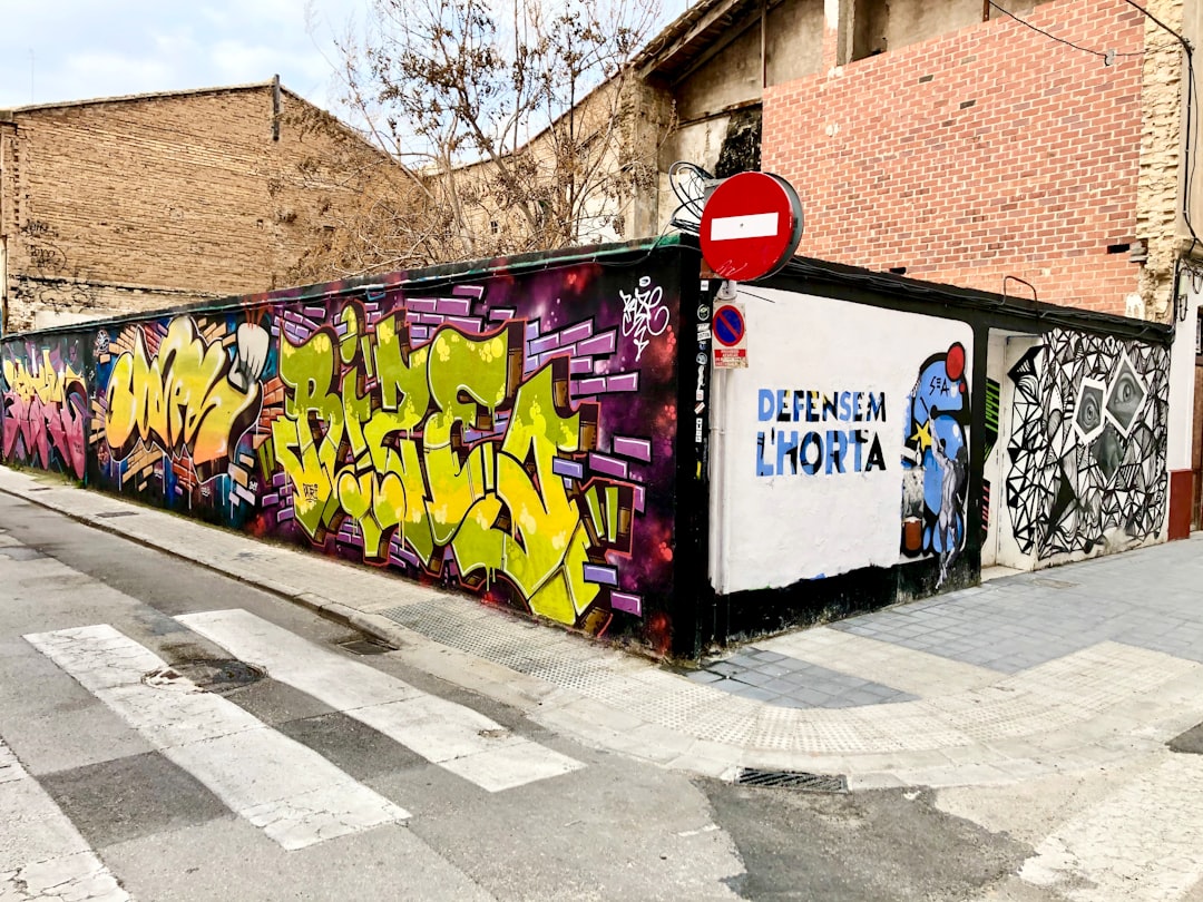 purple and red graffiti on wall