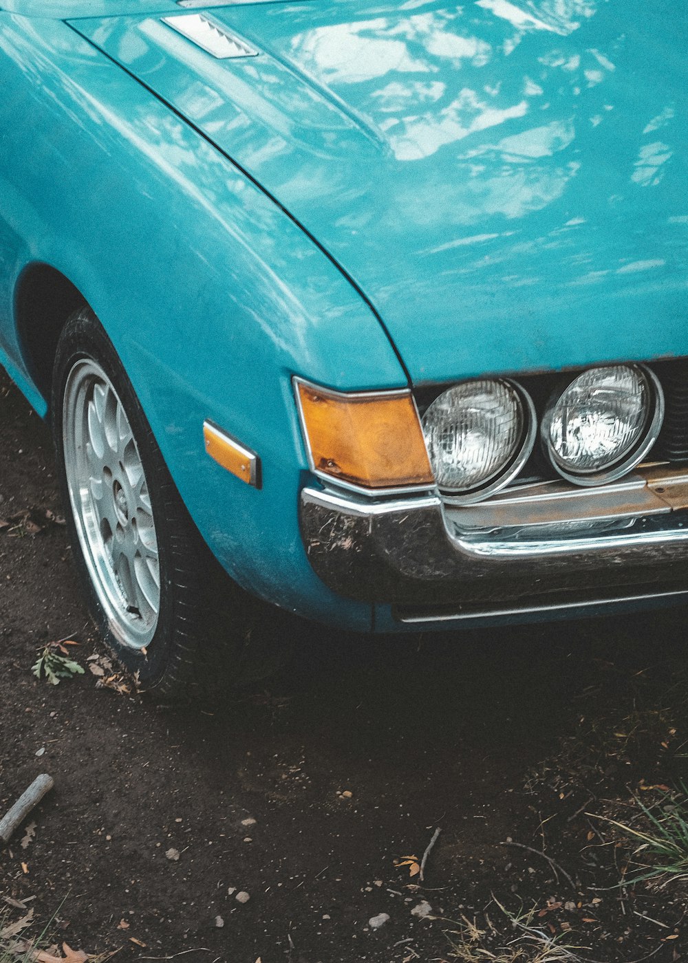 blue car with chrome wheel