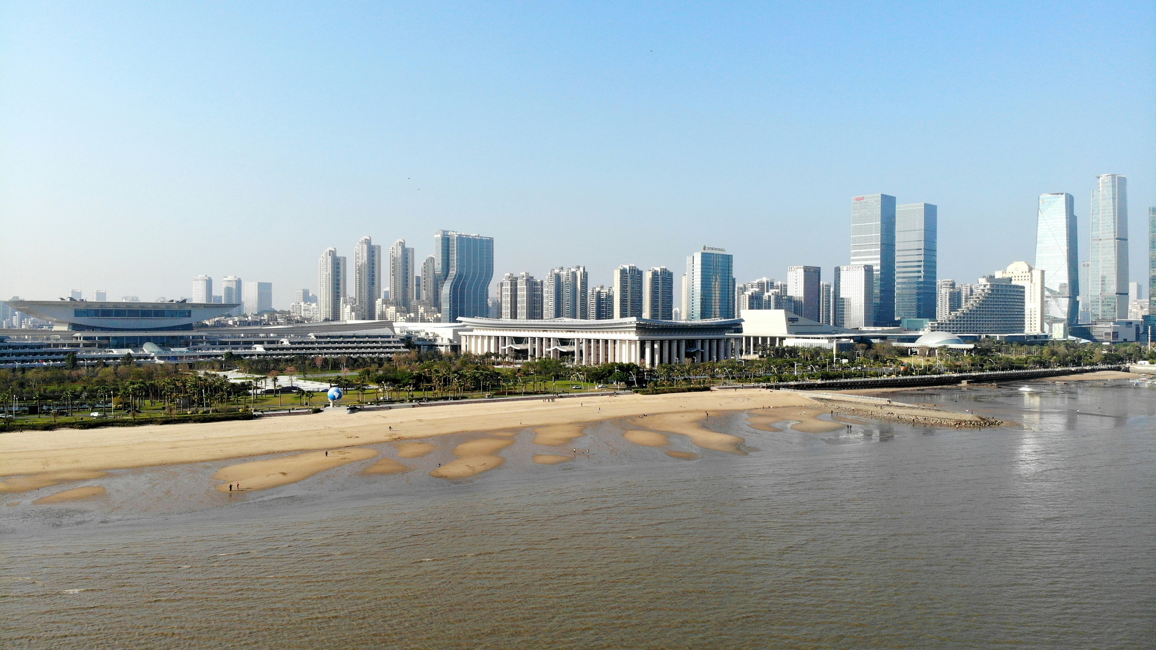 Xiamen city skyline coastal athletics stadium aerial view