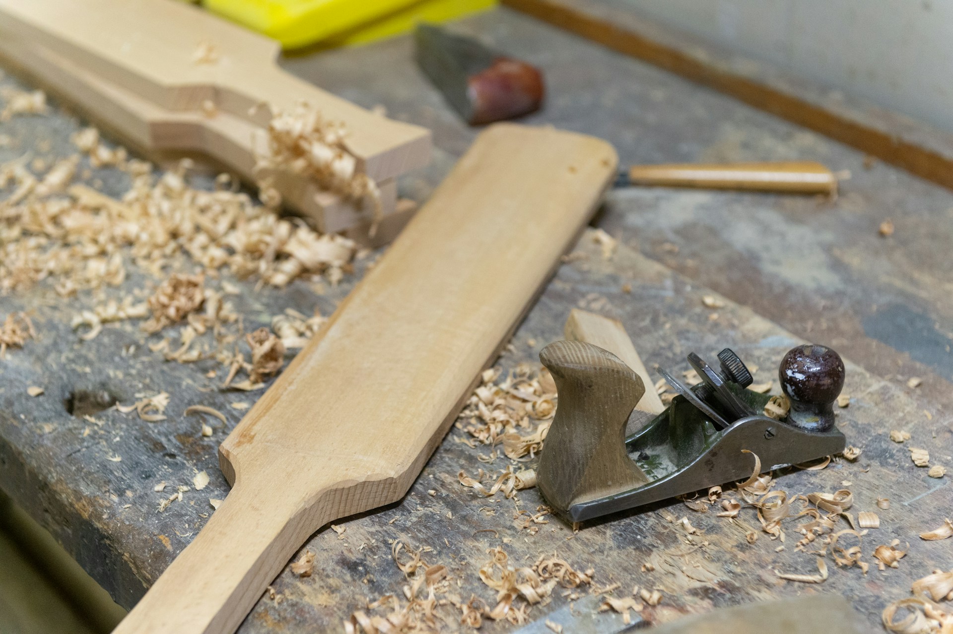 brown wooden handle and black metal tool