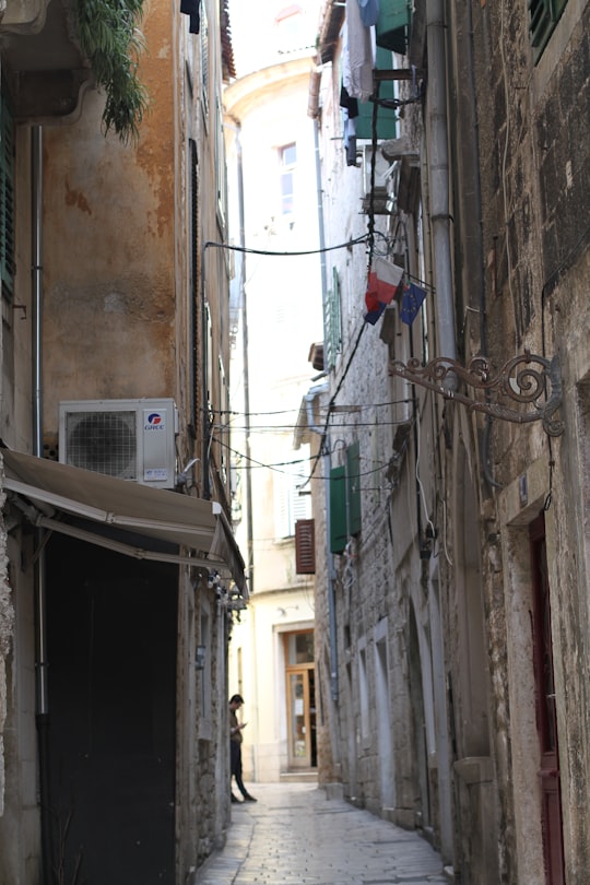 red and black cable wire on gray concrete wall in Split Croatia