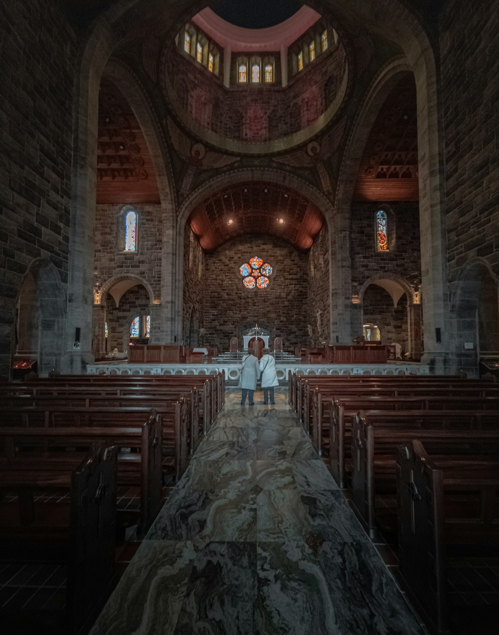 brown wooden chairs inside church